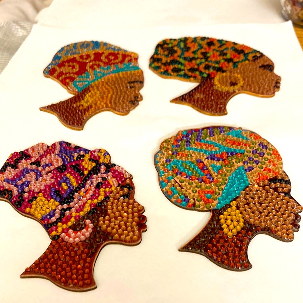4 African women coasters.  Beautiful colors.  On wood. Bme4021